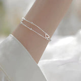 Pulsera ajustable con corazón de plata