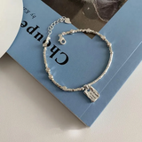 Pulsera cuadrada Amor Plateado