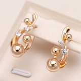 Pendientes Dorados Elegantes y Redondeados con Zirconio
