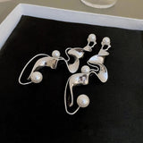 Pendientes vintage abstractos en plata con perlas