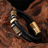 Pulsera de Cuero Negro Trenzado con Colgante Dorado